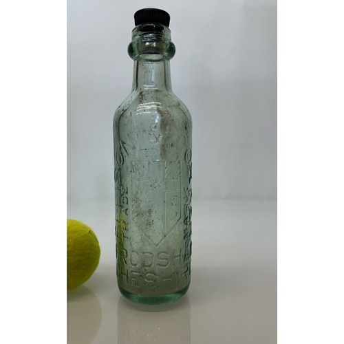 83 - A collection of dug glass drinks bottles, Wales, London, Essex, Cheshire, Bolton, Bedford, and Hitch... 