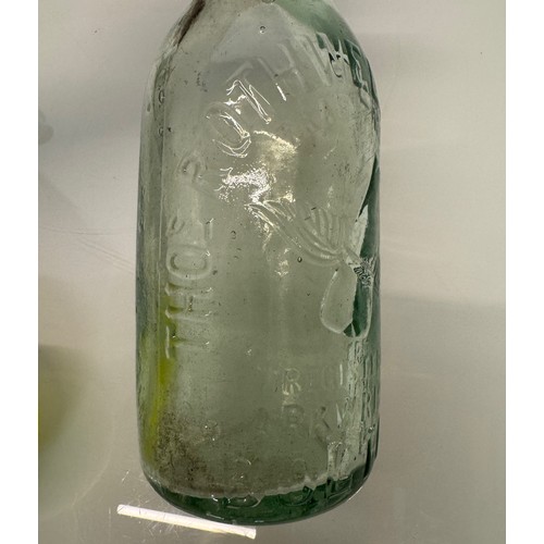 83 - A collection of dug glass drinks bottles, Wales, London, Essex, Cheshire, Bolton, Bedford, and Hitch... 