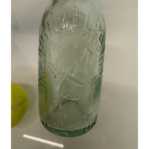 83 - A collection of dug glass drinks bottles, Wales, London, Essex, Cheshire, Bolton, Bedford, and Hitch... 