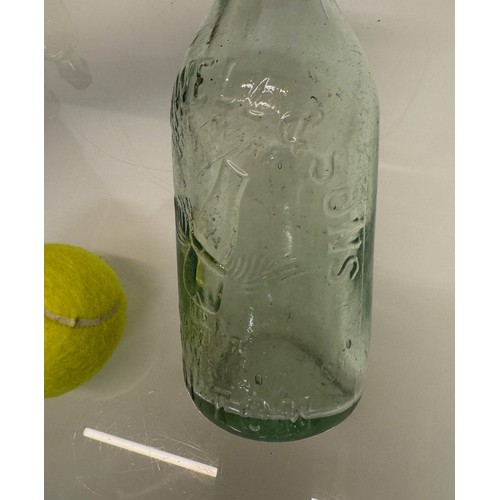 83 - A collection of dug glass drinks bottles, Wales, London, Essex, Cheshire, Bolton, Bedford, and Hitch... 