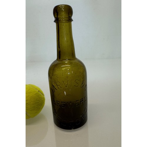 83 - A collection of dug glass drinks bottles, Wales, London, Essex, Cheshire, Bolton, Bedford, and Hitch... 