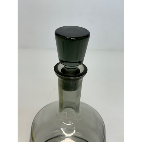 85 - Mid Century smoked glass decanter and glasses.

This lot is available for in-house shipping