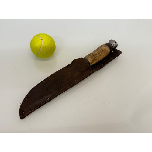 99 - A William Rogers, Cuts My Way Sheath knife with a bone handle. 31 cm long.

This lot is available fo... 