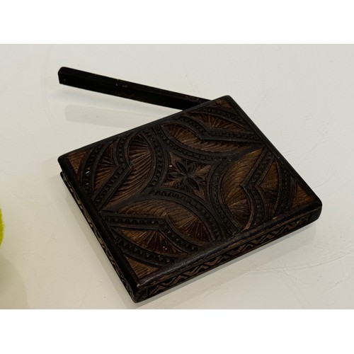 100 - A carved wooden card case, hand decorated on all sides, 10 cm x 8.5 cm.

This lot is available for i... 