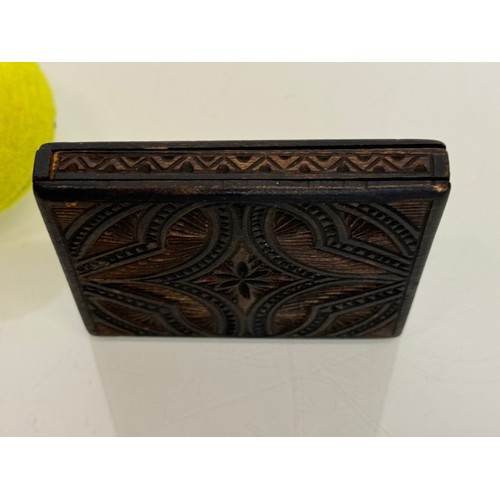 100 - A carved wooden card case, hand decorated on all sides, 10 cm x 8.5 cm.

This lot is available for i... 