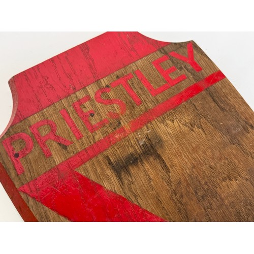 102 - A painted oak house shield marked for Priestley House, possibly after the Polar Explorer. 29 cm x 21... 