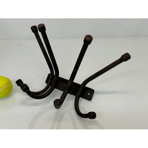 103 - Architectural salvage, a wrought iron coat peg, 32 cm wide x 20 cm.

This lot is available for in-ho... 