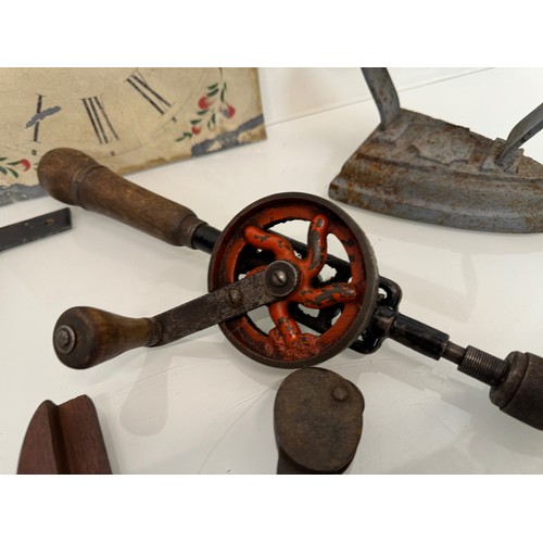 105 - Mixed lot, Clock face, tools, an iron and door fittings.

This lot is available for in-house shippin... 