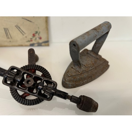 105 - Mixed lot, Clock face, tools, an iron and door fittings.

This lot is available for in-house shippin... 