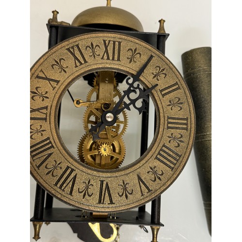 107 - Wall clock with an open case showing the movement. Pendulum is 32 cm long. Dial is 14 cm in diameter... 