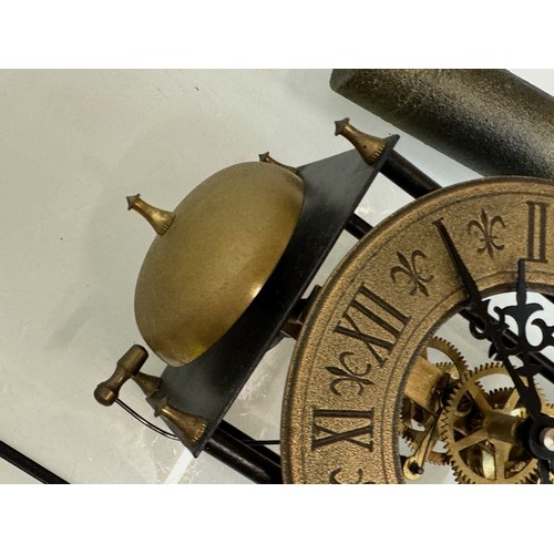 107 - Wall clock with an open case showing the movement. Pendulum is 32 cm long. Dial is 14 cm in diameter... 