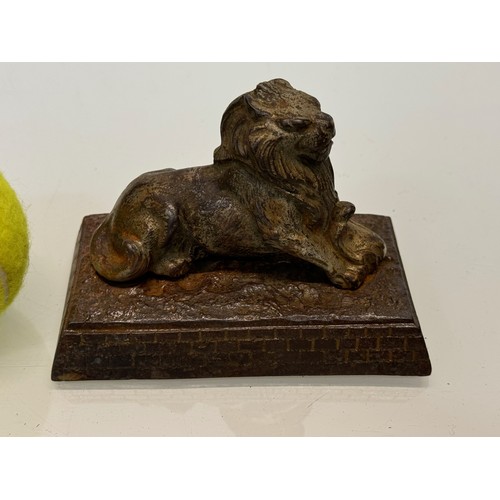 109 - Cast figure of a lion on a plinth. 12 cm x 7.5 cm high.

This lot is available for in-house shipping