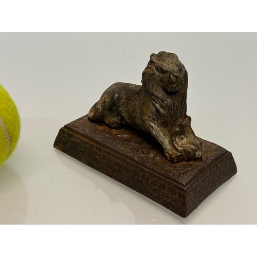 109 - Cast figure of a lion on a plinth. 12 cm x 7.5 cm high.

This lot is available for in-house shipping