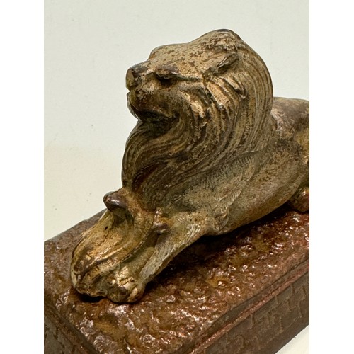 109 - Cast figure of a lion on a plinth. 12 cm x 7.5 cm high.

This lot is available for in-house shipping