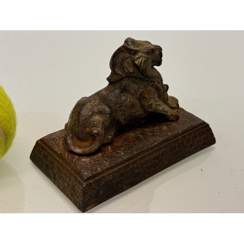 109 - Cast figure of a lion on a plinth. 12 cm x 7.5 cm high.

This lot is available for in-house shipping