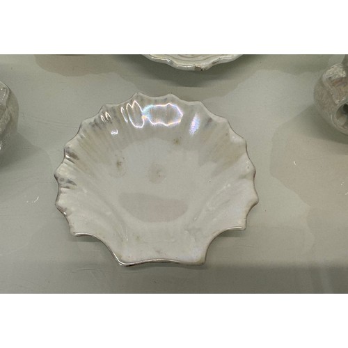 116 - Shell form dressing table wares with a lustre glaze.

This lot is available for in-house shipping