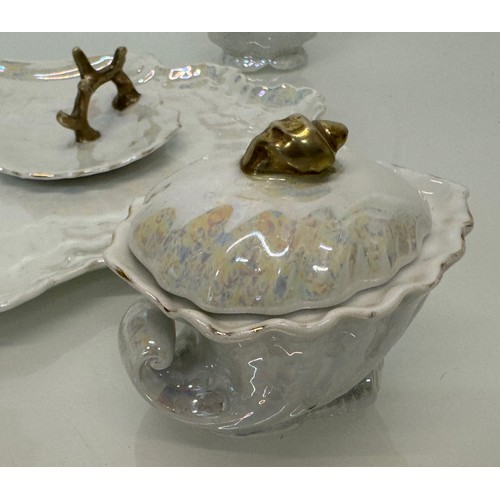 116 - Shell form dressing table wares with a lustre glaze.

This lot is available for in-house shipping