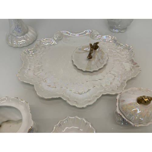 116 - Shell form dressing table wares with a lustre glaze.

This lot is available for in-house shipping