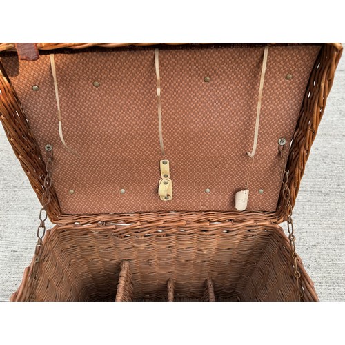 117 - A Brexton wicker work hamper with bottle divisions sectioned off within. A/f 46 cm x 32 cm x 37 cm h... 