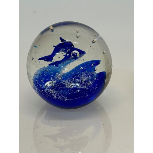 128 - Murano glass paperweight with two blue fish inside.7 cm tall.

This lot is available for in-house sh... 