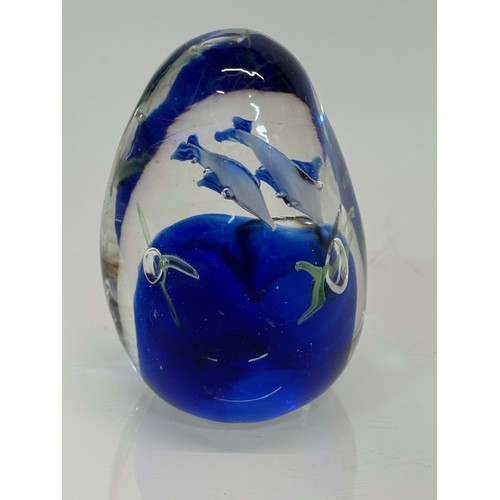 130 - Glass paperweight with two dolphin’s inside an underwater setting. 8 cm high.

This lot is available... 