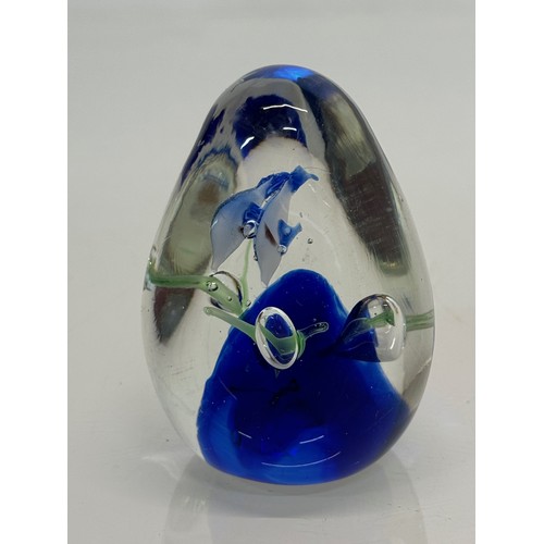 130 - Glass paperweight with two dolphin’s inside an underwater setting. 8 cm high.

This lot is available... 