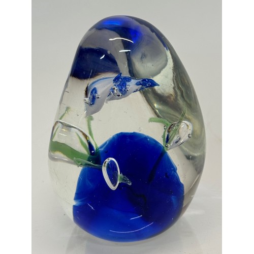 130 - Glass paperweight with two dolphin’s inside an underwater setting. 8 cm high.

This lot is available... 