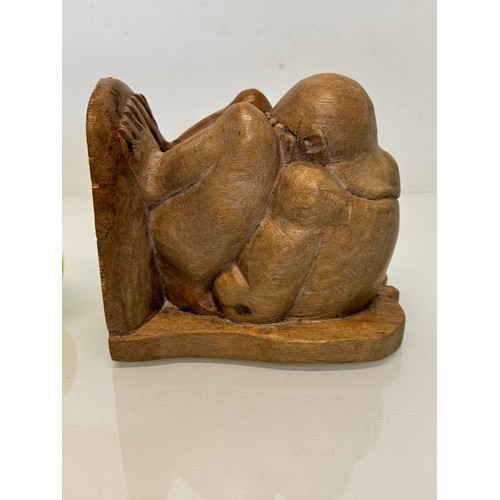 141 - Hand carved constricted figural book end, 16 cm high.

This lot is available for in-house shipping