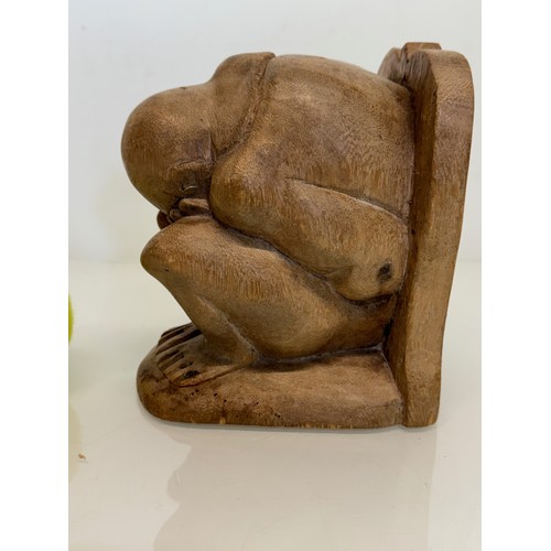 141 - Hand carved constricted figural book end, 16 cm high.

This lot is available for in-house shipping