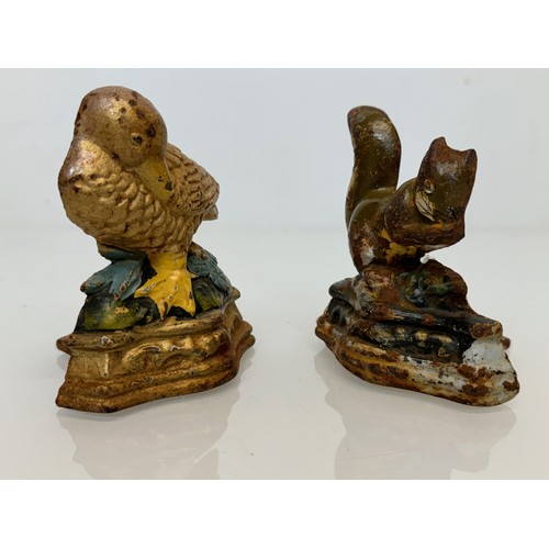 142 - Cast iron door stops duck and a squirrel from late 1930’s.

This lot is available for in-house shipp... 