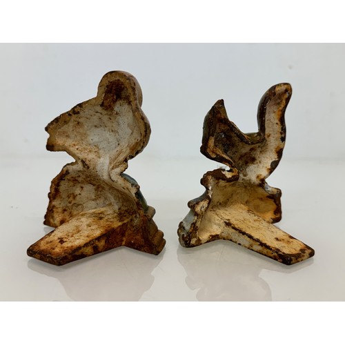 142 - Cast iron door stops duck and a squirrel from late 1930’s.

This lot is available for in-house shipp... 