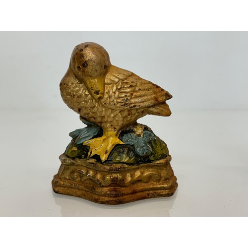 142 - Cast iron door stops duck and a squirrel from late 1930’s.

This lot is available for in-house shipp... 