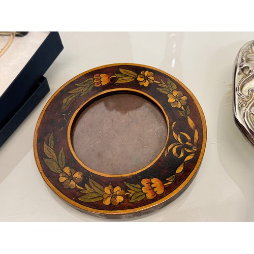 146 - A mixed lot, art nouveau pot, a decorated circular frame etc.

This lot is available for in-house sh... 