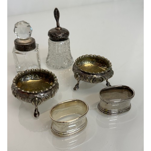 149 - Mixed lot, hall marked silver etc, includes a pair of table salts and a perfume bottle. 

This lot i... 