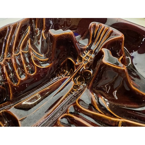 151 - A large ceramic serving dish for a lobster, 32 cm x 24 cm x 10.5 cm tall.

This lot is available for... 