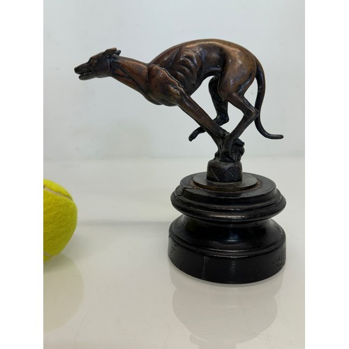 162 - Automobilia, a greyhound mascot marked for Colman on stand, 17 cm high.

This lot is available for i... 