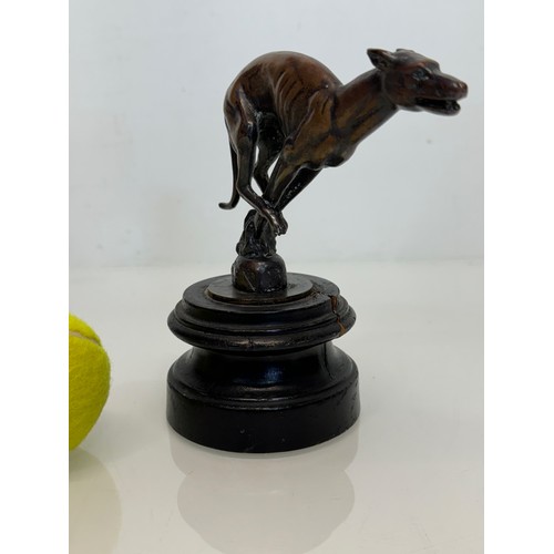 162 - Automobilia, a greyhound mascot marked for Colman on stand, 17 cm high.

This lot is available for i... 