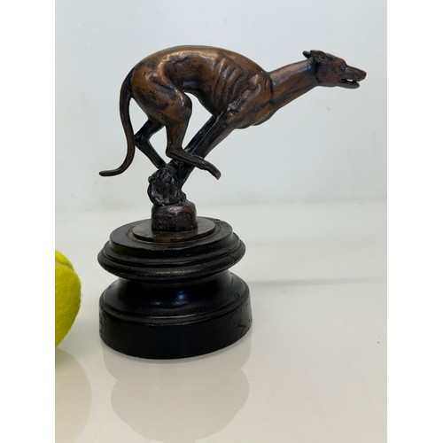 162 - Automobilia, a greyhound mascot marked for Colman on stand, 17 cm high.

This lot is available for i... 