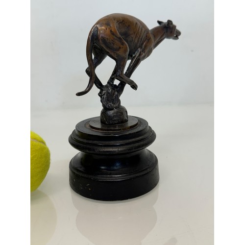 162 - Automobilia, a greyhound mascot marked for Colman on stand, 17 cm high.

This lot is available for i... 