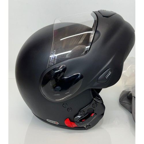 165 - A Davida motorcycle crash helmet size L with flip up chin guard and spare visor.

This lot is availa... 