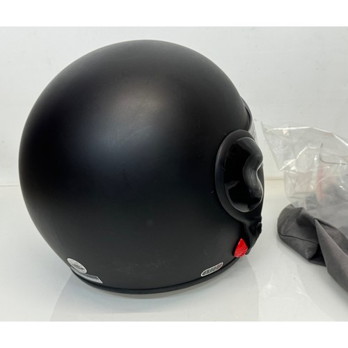 165 - A Davida motorcycle crash helmet size L with flip up chin guard and spare visor.

This lot is availa... 