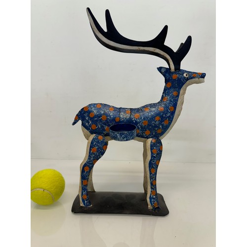 193 - Painted tin plate figure of a reindeer, 35 cm tall.

This lot is available for in-house shipping