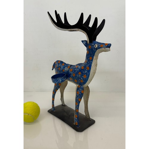 193 - Painted tin plate figure of a reindeer, 35 cm tall.

This lot is available for in-house shipping