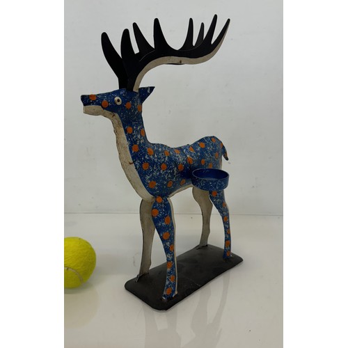 193 - Painted tin plate figure of a reindeer, 35 cm tall.

This lot is available for in-house shipping