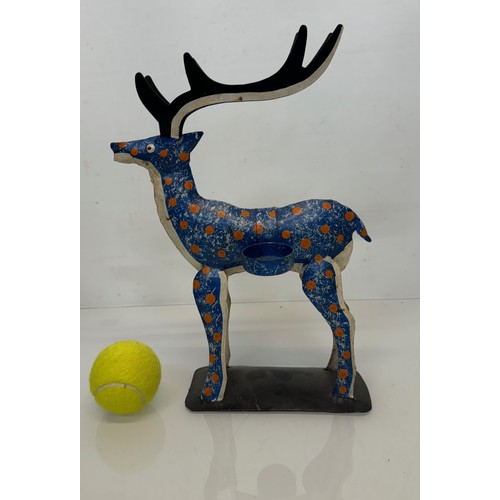 193 - Painted tin plate figure of a reindeer, 35 cm tall.

This lot is available for in-house shipping