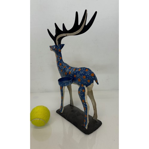 193 - Painted tin plate figure of a reindeer, 35 cm tall.

This lot is available for in-house shipping