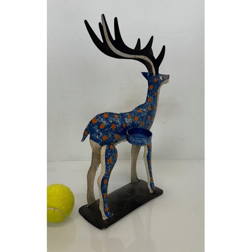 193 - Painted tin plate figure of a reindeer, 35 cm tall.

This lot is available for in-house shipping