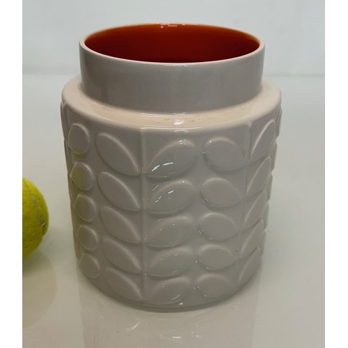 194 - An Orla Kiely vase with an orange glazed interior, 16 cm tall.

This lot is available for in-house s... 