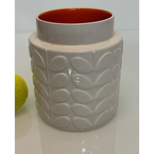 194 - An Orla Kiely vase with an orange glazed interior, 16 cm tall.

This lot is available for in-house s... 