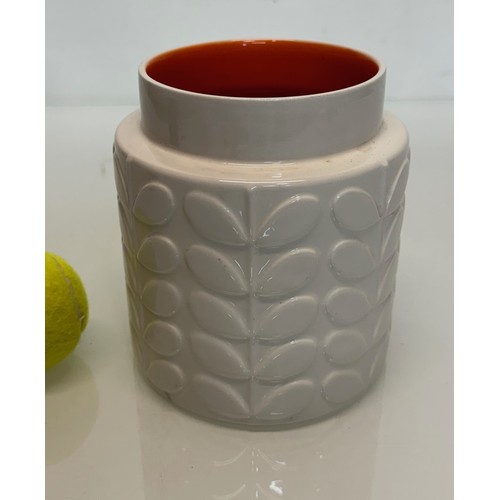 194 - An Orla Kiely vase with an orange glazed interior, 16 cm tall.

This lot is available for in-house s... 